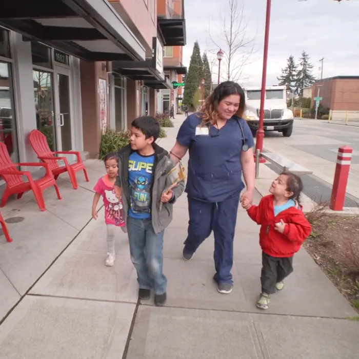 Family walking down the street.