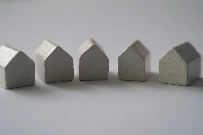 Shapes of white houses in a row.